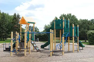 a playground with a slide and a play set
