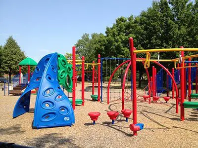 a colorful playground with climbing equipment