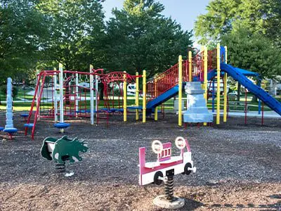 a playground with a slide and a playground equipment