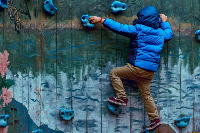 a person climbing a rock wall