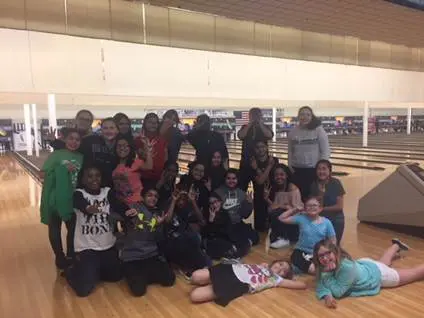 a group of people posing for a photo